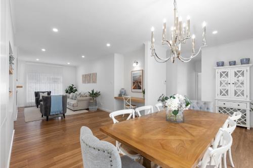 a dining room and living room with a table and chairs at Foxmount Estate Magnus 2 bedroom in Mount Gambier