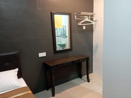 a bathroom with a vanity with a mirror and a sink at D LAYARAN KUANTAN LPT Exit 833 in Kuantan