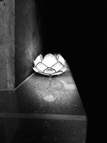 a black and white photo of a tunnel with a light at Residencial Astorga in Rancagua