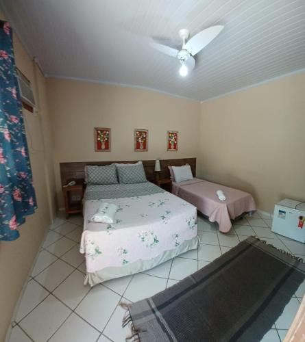Cama o camas de una habitación en Pousada Casa do Bosque