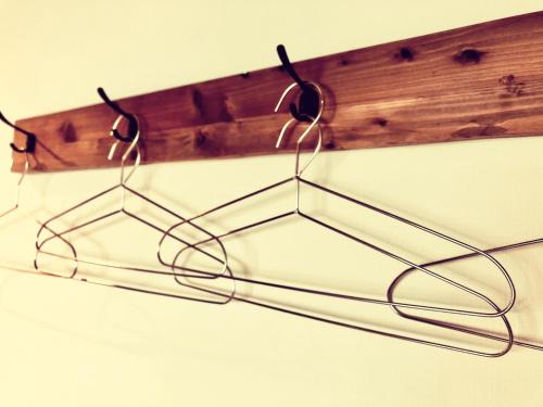 a pair of glasses hanging from a wooden hook at AWAJI OCEAN BASE west coast in Tusi