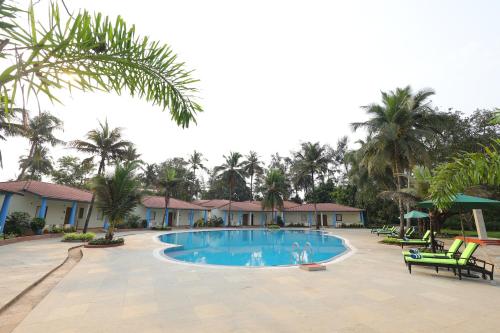 Bazén v ubytování The Windflower Resorts and Spa Varca Goa nebo v jeho okolí