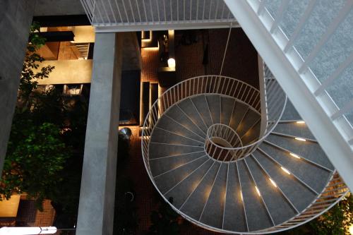 a spiral staircase in a building at SHIROIYA HOTEL in Maebashi