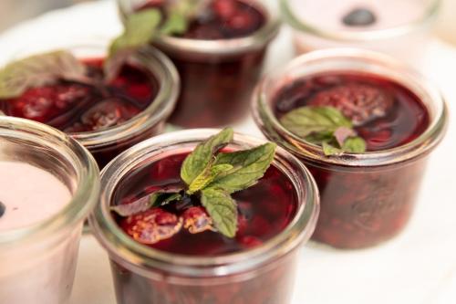 a group of jars of jam with a plant in them at Hotel Gasthof Post in Nesselwang