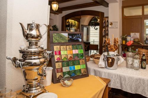 a room with a table with a scarecrow at Hotel Gasthof Post in Nesselwang