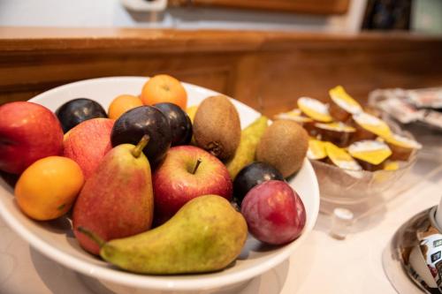 a bowl of fruit sitting on a table at Hotel Gasthof Post in Nesselwang