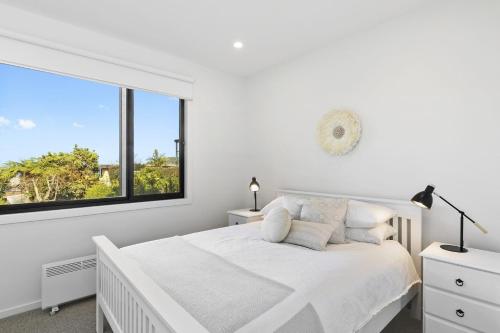 Giường trong phòng chung tại Belvedere Four