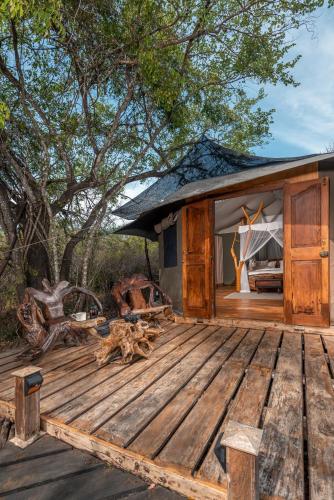 a wooden deck in front of a house at Leopard Safaris Yala in Yala
