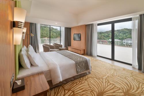 Ένα ή περισσότερα κρεβάτια σε δωμάτιο στο Zenith Hotel Cameron