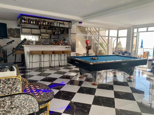 a living room with a pool table and a bar at The Philip Ann Resort in Mabini