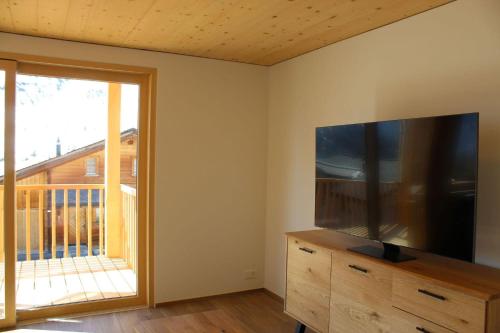 TV a/nebo společenská místnost v ubytování Chalet Sternenhimmel