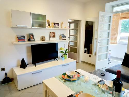 a living room with a tv and a table at Apartment Punta in Pula