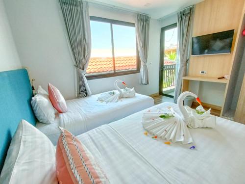 Postel nebo postele na pokoji v ubytování Baan Yuree Resort & Spa - SHA Plus