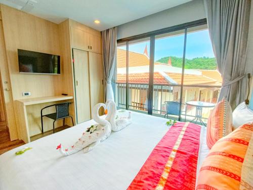 Postel nebo postele na pokoji v ubytování Baan Yuree Resort & Spa - SHA Plus
