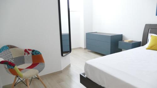 Ένα ή περισσότερα κρεβάτια σε δωμάτιο στο La Caletta Suite Torre Canne