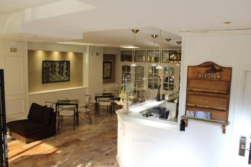 a living room with a couch and a table at Hotel Alda A Boira in Jaca
