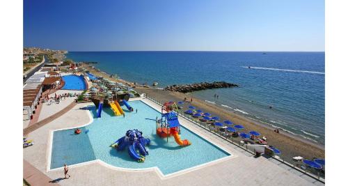 an overhead view of a beach with two water slides at Petra Mare in Ierapetra