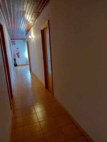 a hallway with a tile floor and a ceiling at Alojamento Local Lindo Verde in Vieira do Minho