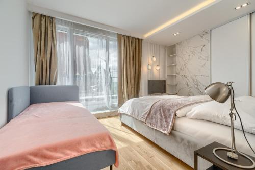 Posteľ alebo postele v izbe v ubytovaní Apartament Prezydencki bulwary Stare Miasto Apartamenty No 1