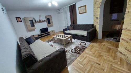 a living room with a couch and a table at GuestHouse in Sarajevo