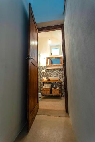 an open door to a hallway with a room at Masseria Ferarelli Trepizzi in Diso