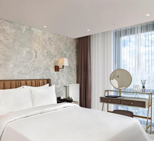 Postel nebo postele na pokoji v ubytování Wanda Vista Residence