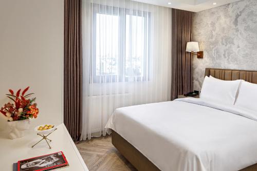 Postel nebo postele na pokoji v ubytování Wanda Vista Residence