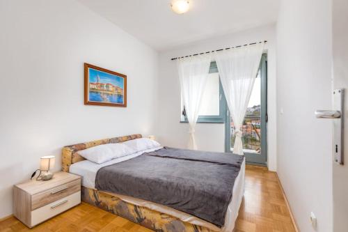 Posteľ alebo postele v izbe v ubytovaní Apartman Dokić 3