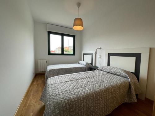 Postel nebo postele na pokoji v ubytování Apartamento Cristina