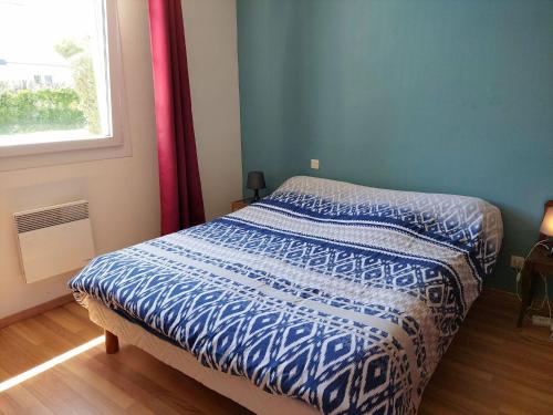 En eller flere senge i et værelse på Holiday Home in Santec near Dossen Beach