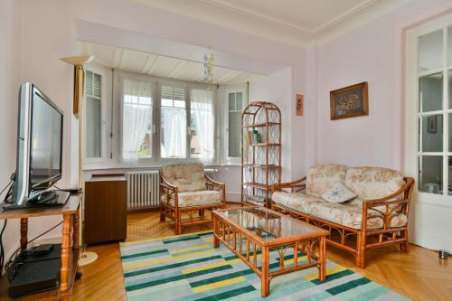 TV a/nebo společenská místnost v ubytování Gîte Le Noisetier