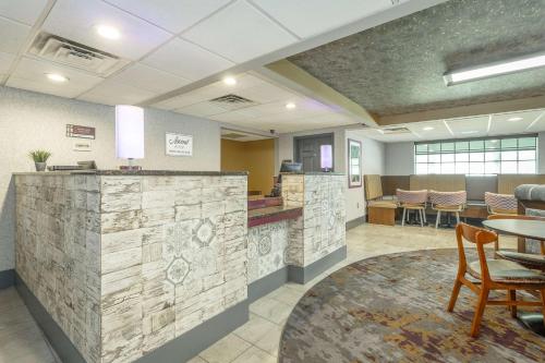 a lobby of a hospital with a table and chairs at District 3 Hotel, Ascend Hotel Collection in Chattanooga