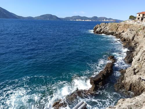 a view of the ocean from a cliff at Panorama Apartments in Asos