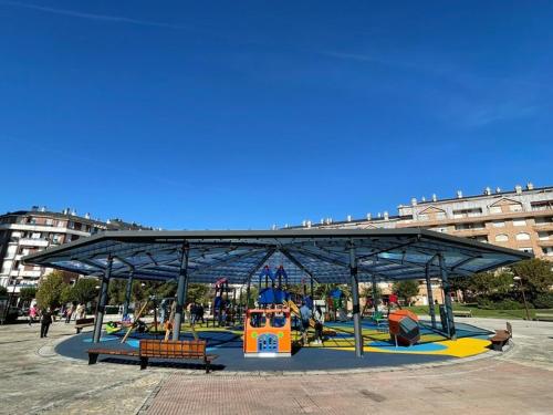a park with a playground with a play structure at Apt Las Olas Cotolino con parking a 2' de la playa in Castro-Urdiales