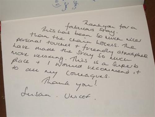 a handwritten letter with handwriting on a piece of paper at Hazelwood House in Bridgend