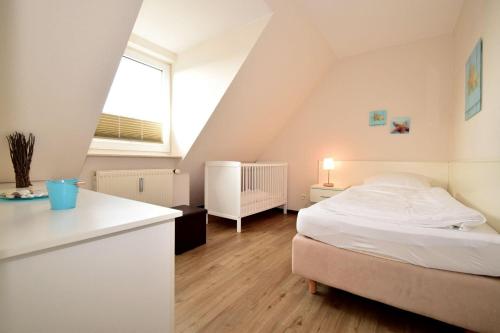 Postel nebo postele na pokoji v ubytování Haus Seemeile Wohnung 3 8