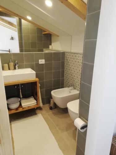 a bathroom with a sink and a toilet at Apartment Mauro in Baška