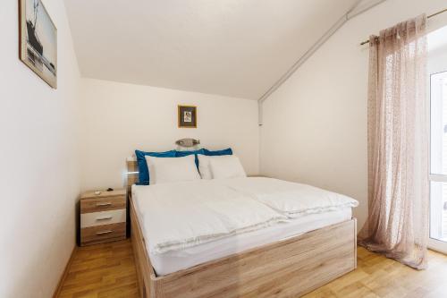 a bedroom with a bed and a window at HOUSE MIRKO- center of Split in Split