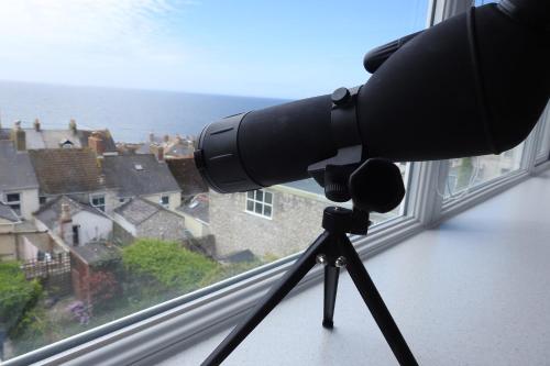 a camera on a tripod in front of a window at Cuddy in Castletown