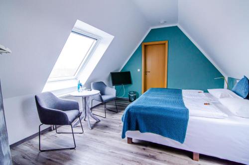 Postel nebo postele na pokoji v ubytování Hotel Blischke