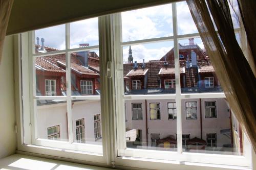an open window with a view of a building at Tallinn City Apartments Old Town Toompea in Tallinn