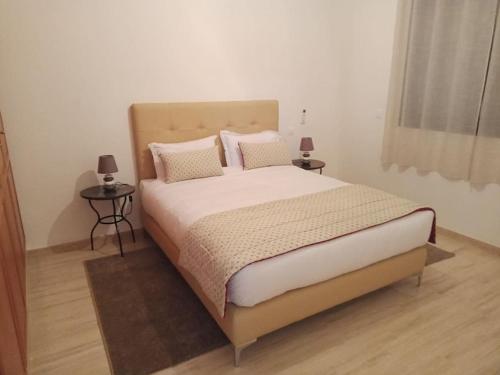 A bed or beds in a room at Suites Appartement Midelt