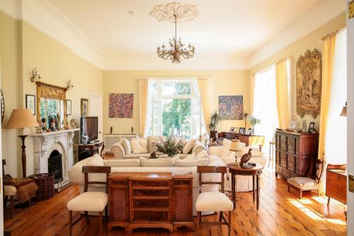a living room with a couch and a table at Annamult Country House Estate in Kilkenny