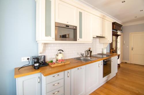 Kuchyň nebo kuchyňský kout v ubytování Maya's Flats & Resorts - Staromiejski Apartments