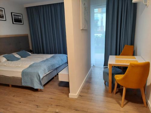 Ένα ή περισσότερα κρεβάτια σε δωμάτιο στο Aqua Resort by Sunny