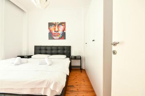 Postel nebo postele na pokoji v ubytování Thessaloniki City Apartment Center