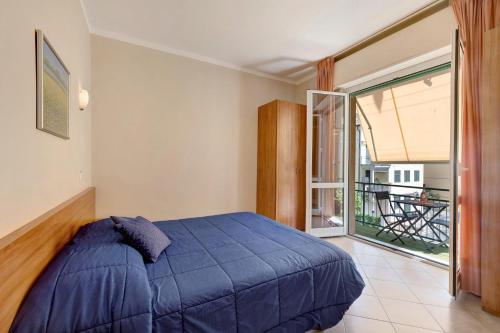 En eller flere senge i et værelse på Isophylla Bon Comfort