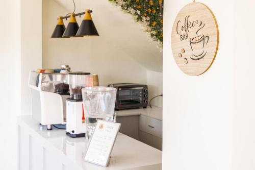 a kitchen with a counter with a blender on it at The Garden Galleries Boutique Hotel in Pilar