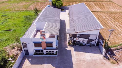 an overhead view of a house with a sign on it at The Garden Galleries Boutique Hotel in Pilar