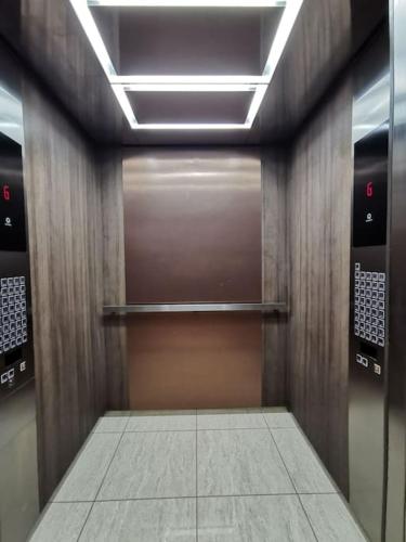 a elevator with a door in a building at Almas Muji Studio 100mbps Netflix STAY in Nusajaya